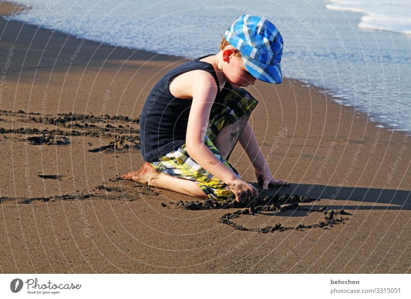 written | in sand Vacation & Travel Tourism Trip Adventure Far-off places Freedom Child Boy (child) Parents Adults Family & Relations Infancy Body Skin Head