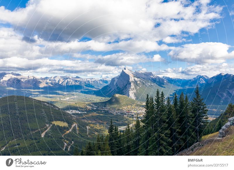 Mountain range near Banff Alberta Canada Climbing Mountaineering Hiking Nature Landscape Plant Sky Clouds Beautiful weather Tree Grass Forest Rock Peak