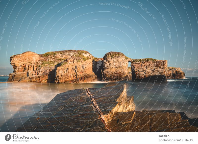 formation Nature Landscape Sky Cloudless sky Horizon Summer Beautiful weather Rock Waves Coast Reef Ocean Island Maritime Blue Brown Colour photo Exterior shot