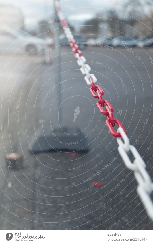 chain Captured Exclude Barrier Street Parking lot Asphalt Places Parking facilities Car Search for a parking space Chain Chain link Reddish white City life Town