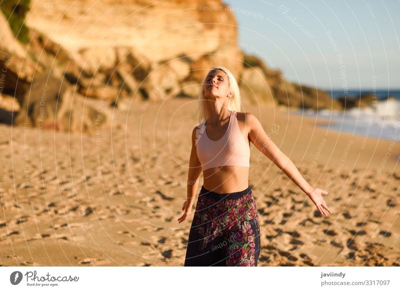 Woman enjoying the sunset on a beautiful beach Lifestyle Happy Beautiful Body Relaxation Leisure and hobbies Vacation & Travel Freedom Summer Sun Beach Ocean