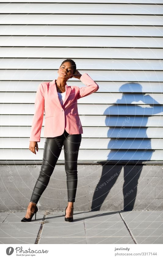 Black woman, model of fashion, standing on urban wall Style Beautiful Hair and hairstyles Work and employment Human being Feminine Young woman