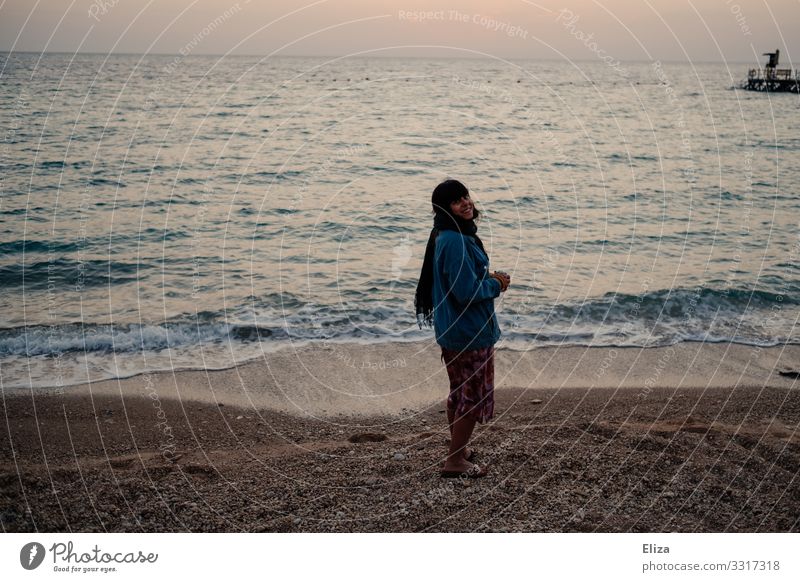 700 I A girl on the beach is happy Woman Girl Beach pleased Smiling Waves Pebble beach Sunrise vacation travel Vacation & Travel Ocean Coast Sand Water