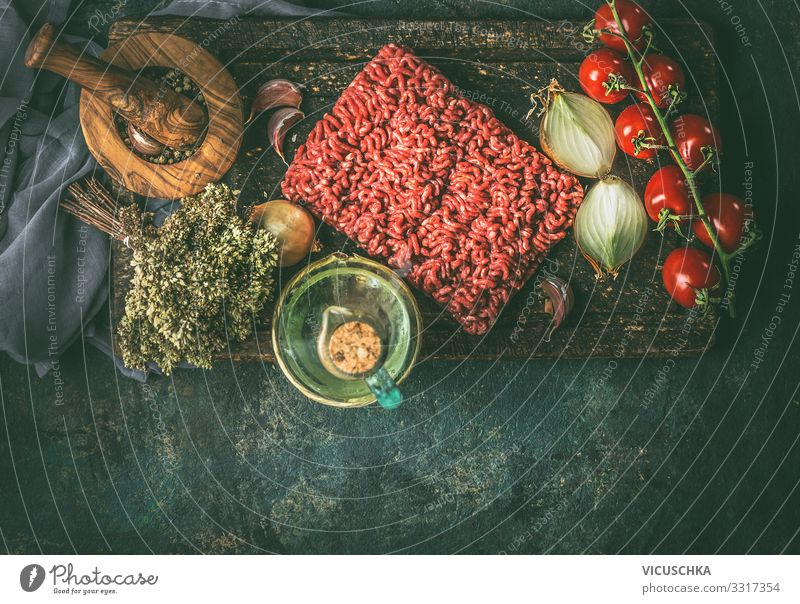 Raw minced meat with cooking ingredients Food Meat Vegetable Herbs and spices Cooking oil Nutrition Organic produce Crockery Design Living or residing Kitchen