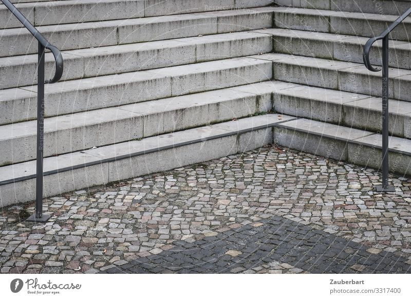 ruling Berlin Town Deserted Places Stairs Banister Paving stone Cobblestones Stone Concrete Sharp-edged Gloomy Gray Orderliness Boredom Arrangement Divide