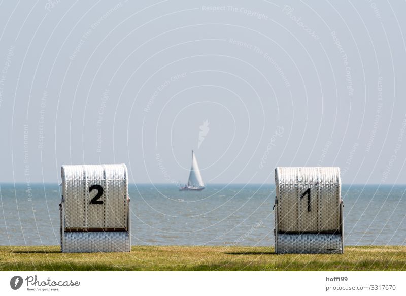 two beach chairs by the sea with a sailboat in the distance Aquatics Sail Sailboat Beach chair Water Sky Cloudless sky Beautiful weather Lawn Coast North Sea