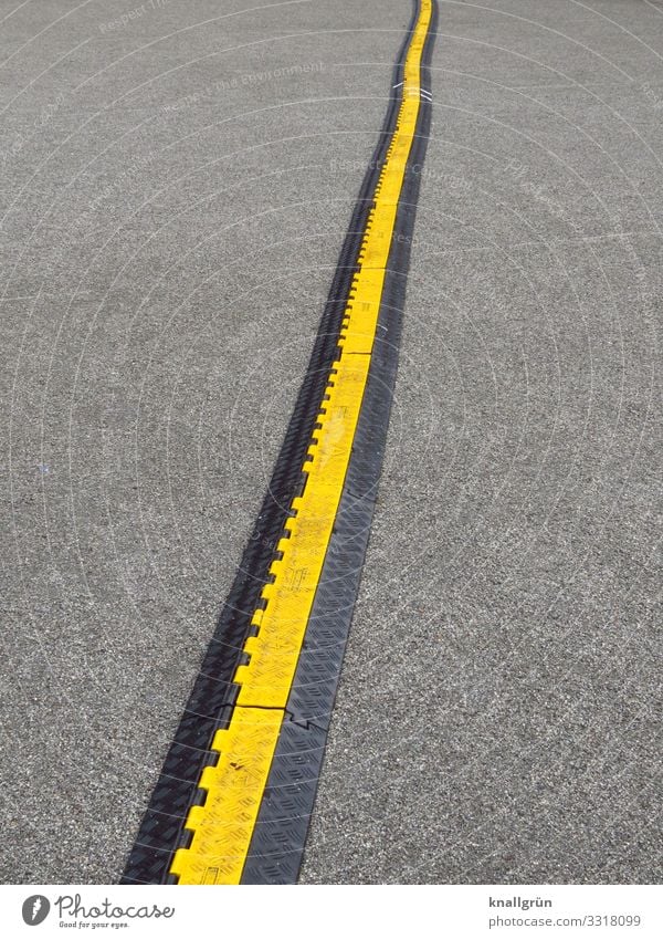 Several meters black-yellow cable bridge running through the picture from bottom to top Cable bridge Safety Protection Barrier Deserted Day Colour photo