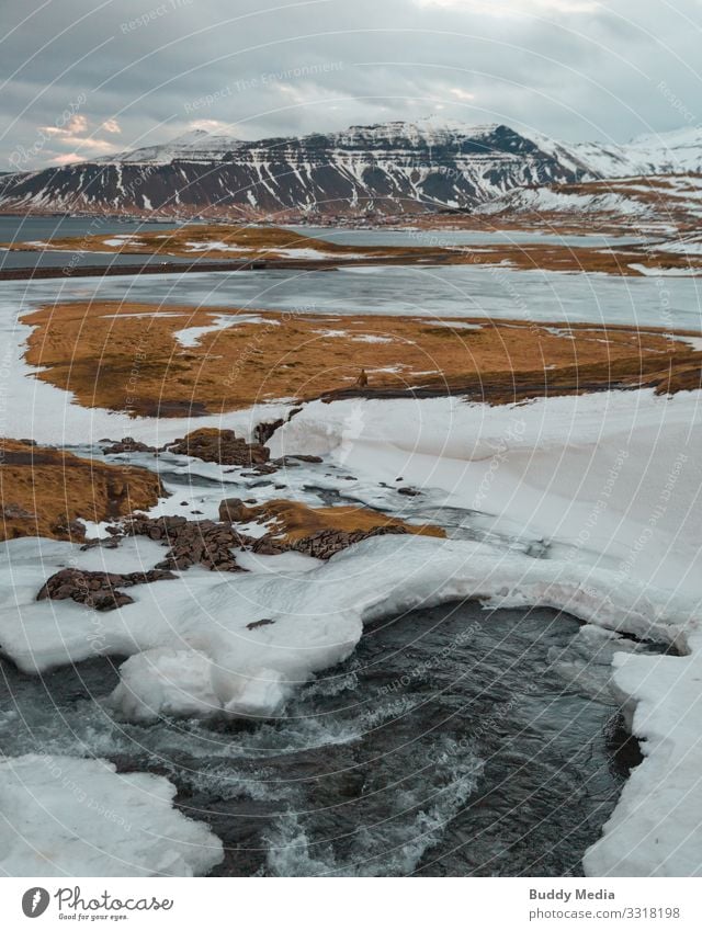 Kirkjufellsfoss on the Snaefellsnes Peninsula in Iceland Expedition Snow Nature Landscape Earth Water Sky Clouds Spring Weather Drought Grass Meadow Rock