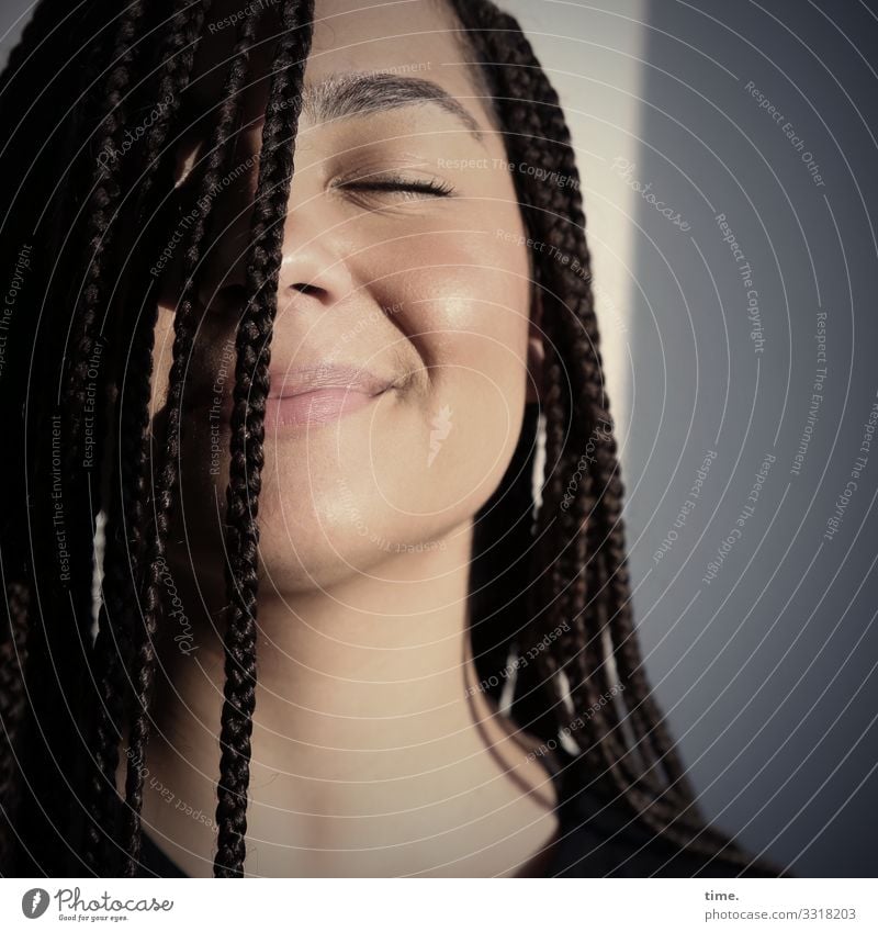 satisfied woman with braided hair in the evening sun Room Feminine Woman Adults 1 Human being Wall (barrier) Wall (building) T-shirt Brunette Long-haired Afro