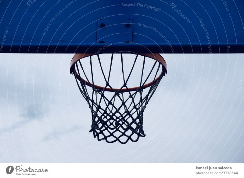 basketball hoop on the street, street basket in Bilbao city Spain sky blue silhouette circle chain metallic net sport sports equipment play playing playful old