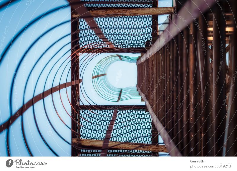 metal construction with stairs steps in perspective view Industry Architecture Metal Rust Old Blue abstraction background bends curves Geometry Grunge