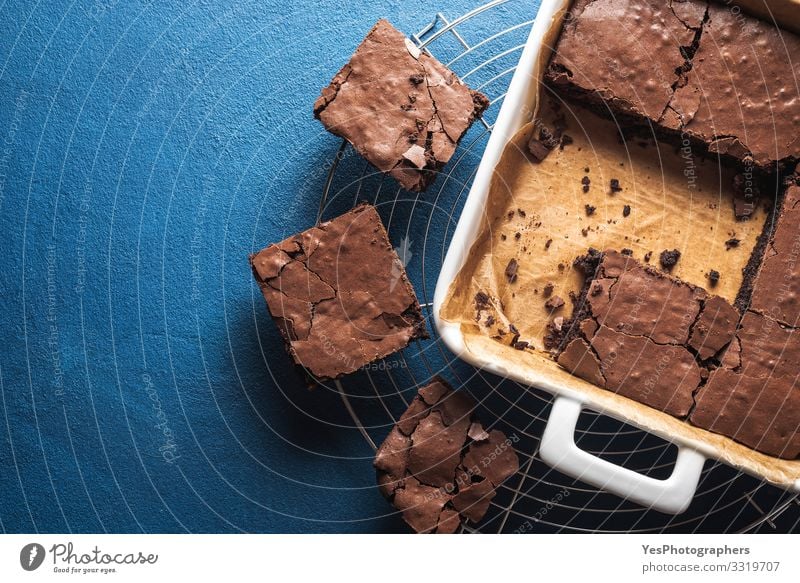 Brownies in a pan and on a cooling tray. Homemade brownies Food Cake Dessert Candy Chocolate Pan Delicious Sweet Blue above view american dessert Baked goods