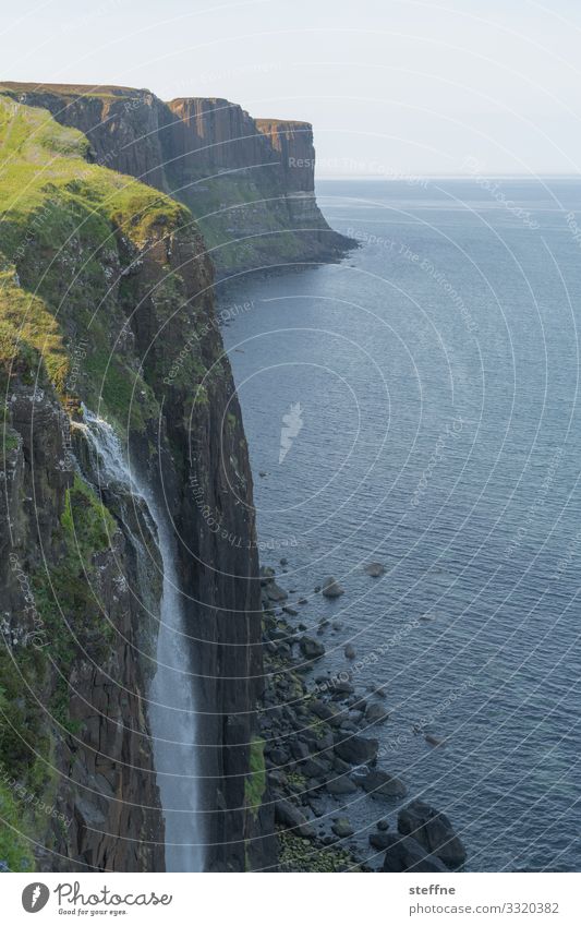 Cliff at the sea with waterfall steep coast Ocean Waterfall Scotland Isle of Skye Nature Landscape Vacation mood