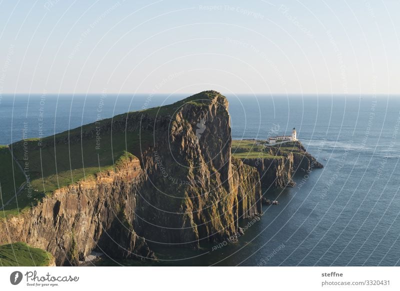 Cliff at the sea with lighthouse steep coast Ocean Scotland Isle of Skye Nature Landscape Vacation mood Lighthouse Exterior shot Travel photography Island