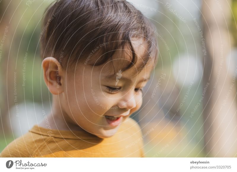 happy young boy playing outdoors in the park Lifestyle Joy Happy Leisure and hobbies Playing Child Boy (child) Man Adults Family & Relations Friendship Infancy