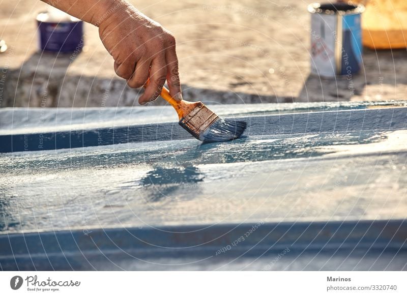 Closeup view of hand holding a paintbrush with blue color. Design Ocean Craft (trade) Human being Adults Hand Art Watercraft Blue Creativity Hold painting