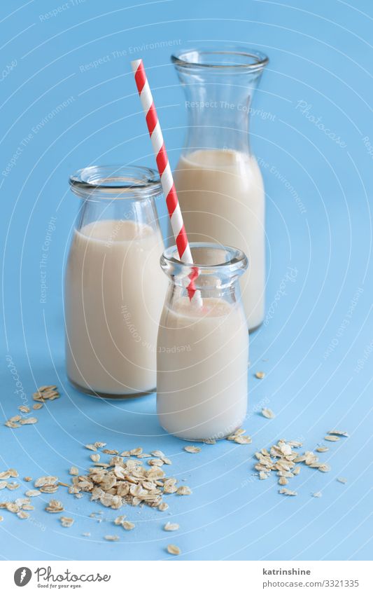 Vegan oat milk, non dairy alternative milk Vegetable Nutrition Breakfast Vegetarian diet Diet Beverage Bottle Spoon Table Fresh Natural Alternative Oats