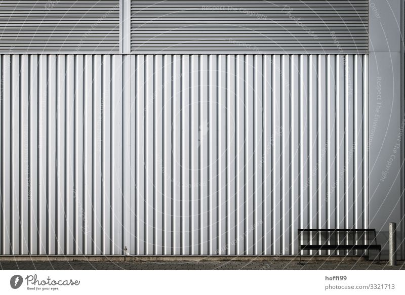 lonely bench with ashtray in front of corrugated iron facade House (Residential Structure) Industrial plant Architecture Wall (barrier) Wall (building) Facade