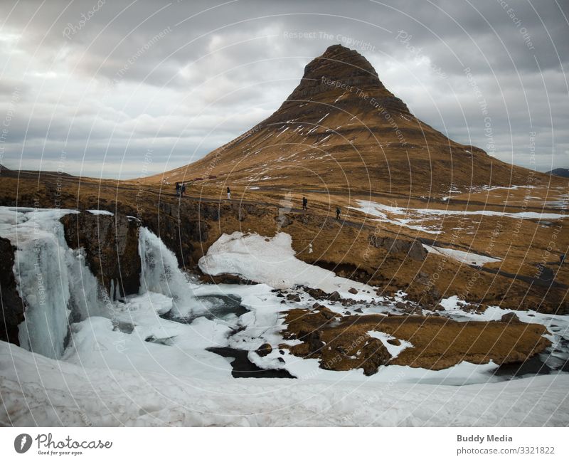 Kirkjufellsfoss on the Snaefellsnes Peninsula in Iceland Expedition Winter Snow Mountain Hiking Nature Landscape Earth Water Drops of water Sky Clouds Spring