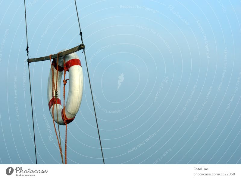 lifebelt Sky Cloudless sky Bright Near Maritime Red Black White Rope Life belt Navigation Watercraft Colour photo Multicoloured Exterior shot Close-up Deserted