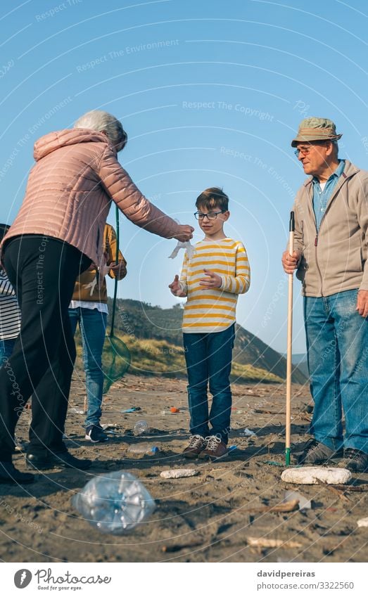 Volunteers preparing to clean the beach Beach Child Human being Boy (child) Woman Adults Man Family & Relations Group Environment Sand Gloves Plastic Old Dirty