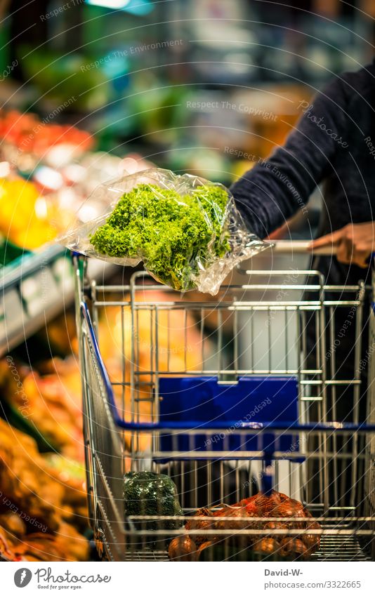 Supermarket - food in plastic packaging Shopping Trolley Food Colour photo Consumption Store premises Human being Plastic packaging Plastic world