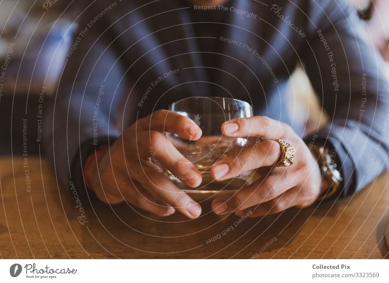 Successful man holding whiskery glass with gold ring Masculine Hand Fingers 1 Human being 18 - 30 years Youth (Young adults) Adults Glass Responsibility