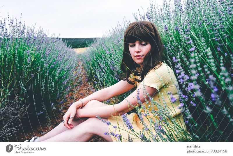 Young brunette woman sitting surrounded by lavender Lifestyle Beautiful Relaxation Calm Freedom Summer Human being Feminine Young woman Youth (Young adults)