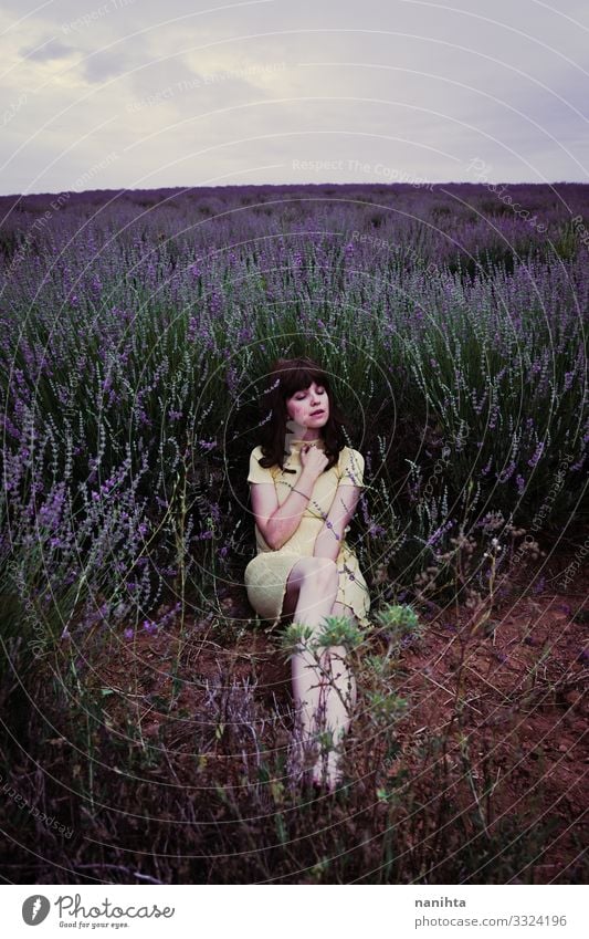 Young brunette woman sitting surrounded by lavender Lifestyle Beautiful Relaxation Calm Freedom Summer Human being Feminine Young woman Youth (Young adults)