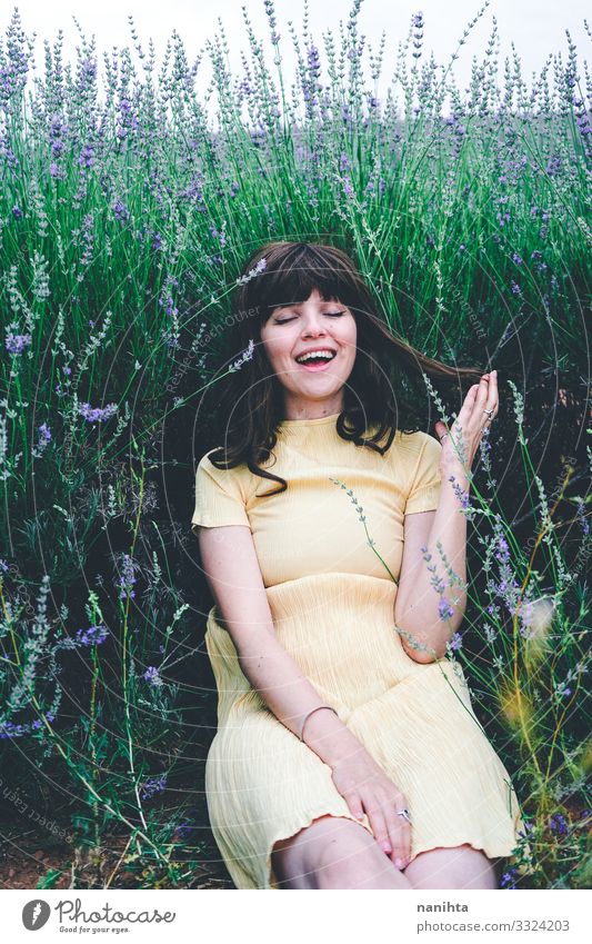 Young brunette woman sitting surrounded by lavender Lifestyle Beautiful Relaxation Calm Freedom Summer Human being Feminine Young woman Youth (Young adults)