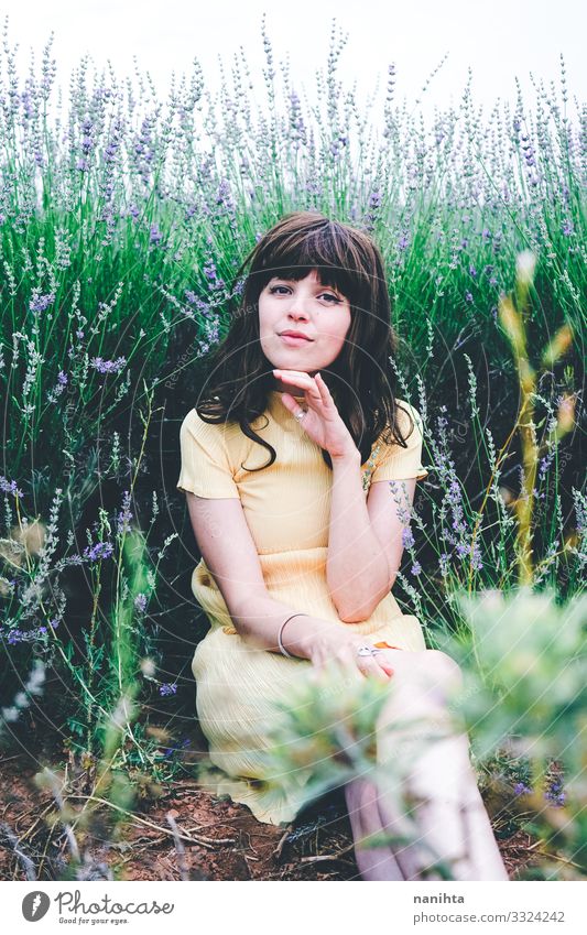 Young brunette woman sitting surrounded by lavender Lifestyle Beautiful Relaxation Calm Freedom Summer Human being Feminine Young woman Youth (Young adults)