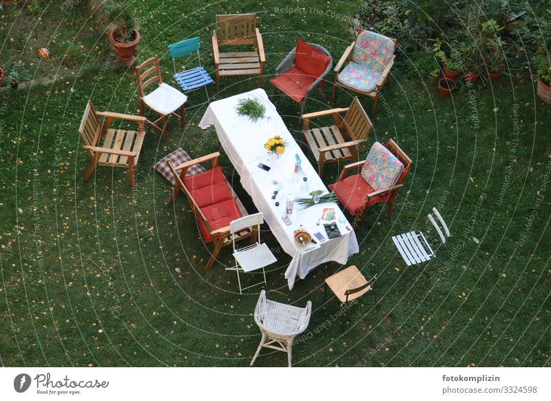 abandoned garden chairs around a table after a party Garden Feasts & Celebrations Table Eating Garden festival To have a coffee celebration Outdoor furniture