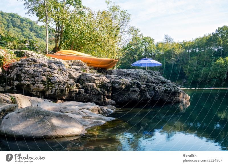 orange boat and blue umbrella by the river in the forest Vacation & Travel Tourism Camping Mountain Hiking Nature Landscape Plant Sky Clouds Tree Grass Leaf