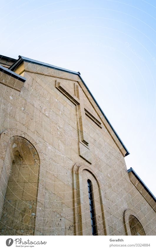 modern christian church with a cross on the wall in Georgia Vacation & Travel Tourism Sky Church Building Architecture Stone Tall Modern Blue Colour Belief