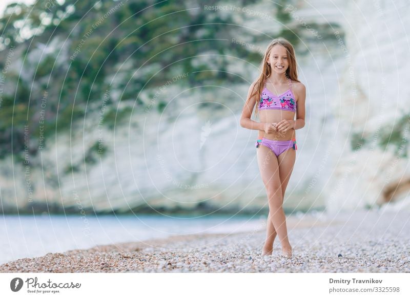 Cute little girl at beach during summer vacation Lifestyle Joy Happy Beautiful Relaxation Leisure and hobbies Vacation & Travel Summer Sun Beach Ocean Island