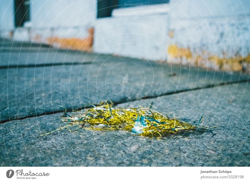 Tinsel in gold - the rest of Christmas Town Poverty Christmas & Advent Anti-Christmas Late Sidewalk Trash Gold Remainder Dispose of Christmas decoration