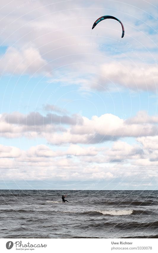 Kitesurfer on rough sea under pink clouds Lifestyle Summer vacation Ocean Waves Aquatics Kitesurfing 1 Human being Water Clouds Baltic Sea Fitness Sports