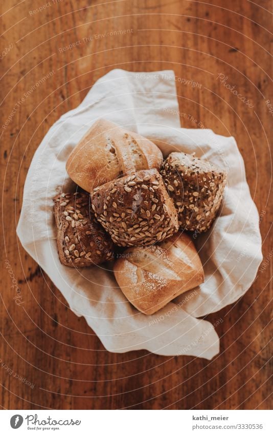 Rolls in basket Food Grain Dough Baked goods Nutrition Breakfast Dinner Organic produce Tablecloth Shopping Wood Healthy Sustainability Brown Yellow Gold