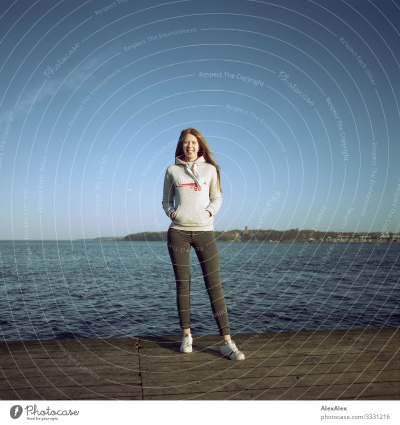 Young woman on a jetty at the Baltic Sea Lifestyle Joy Beautiful Harmonious Vacation & Travel Trip Youth (Young adults) 18 - 30 years Adults Landscape Autumn