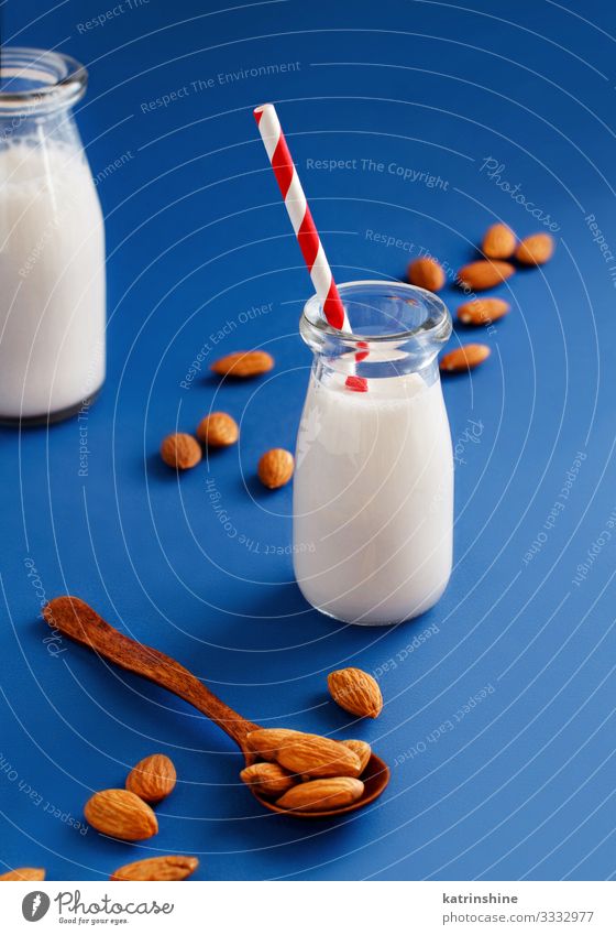 Vegan almond milk, non dairy alternative milk Vegetable Nutrition Breakfast Vegetarian diet Diet Beverage Bottle Spoon Fresh Natural Blue Alternative almonds