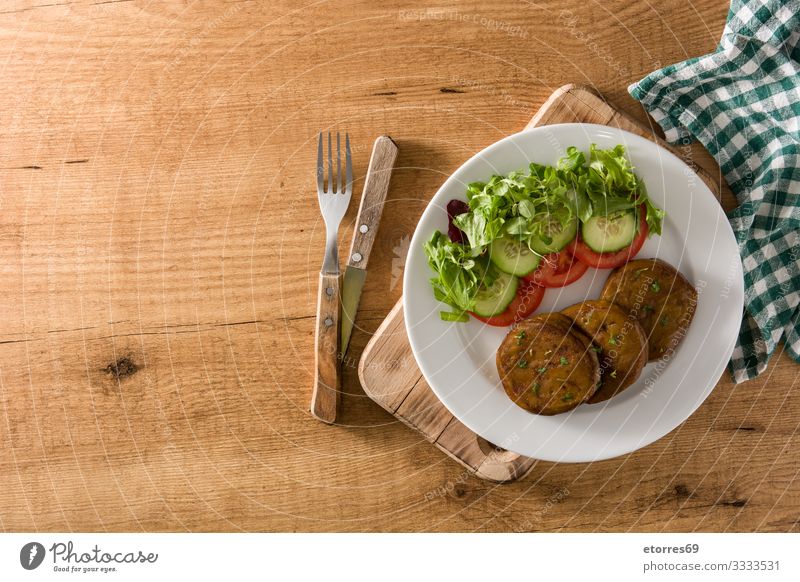 Seitan with vegetables on wooden table. Fake meat seitan Vegan diet Meat fake Alternative Food Healthy Eating Food photograph Vegetarian diet Protein Salad