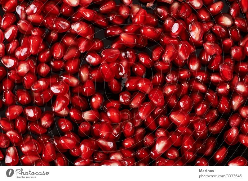 pomegranate seeds on black background. Fruit Dessert Vegetarian diet Diet Juice Garden Table Fresh Natural Juicy Red Colour dieting health Vitamin Organic