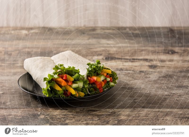 Vegetable tortilla wraps on wooden table. Wrap Roll Flat bread Food Healthy Eating Food photograph Spring Vegetarian diet Mix Carrot Lettuce Tomato pepper Slice