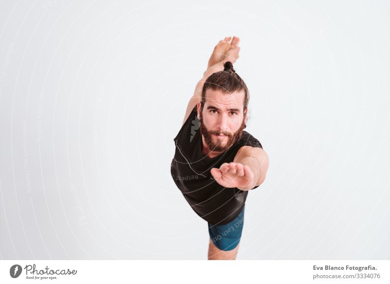 young man practicing yoga sport at the gym. Healthy lifestyle Yoga Man Boy (child) Sports Lifestyle Interior shot Gymnasium Studio shot White hispanic Athletic