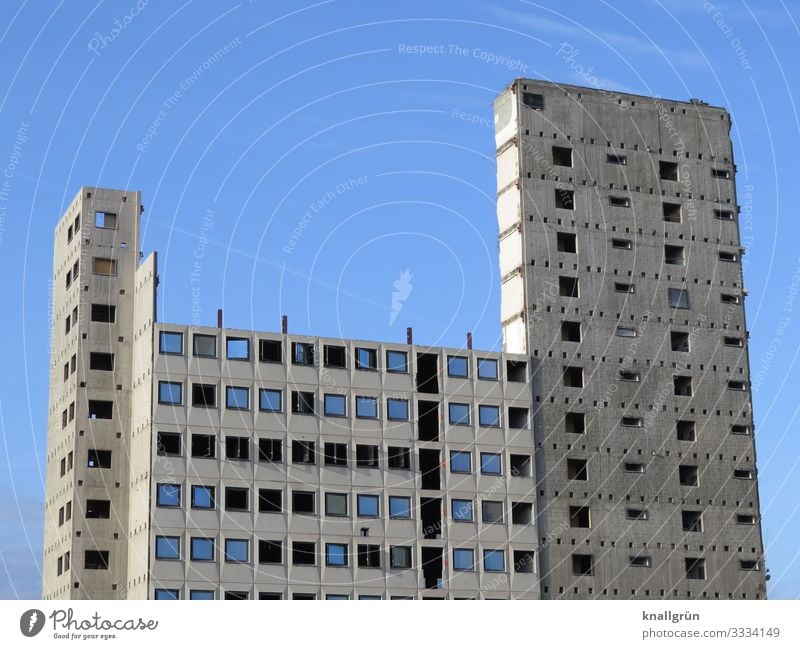 Vacant office building shortly before demolition Building for demolition vacant High-rise Concrete Empty Tall Gray Blue Sky Black Ruin Unfinished building