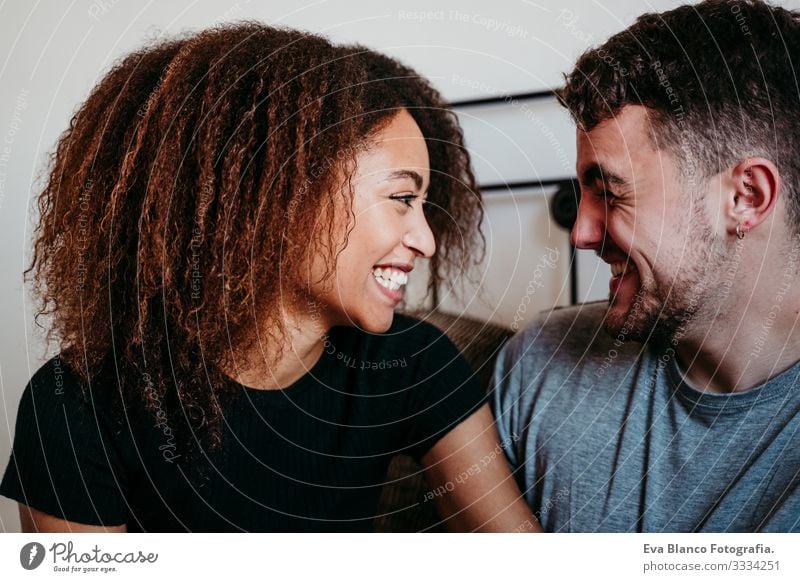 happy couple in love at home. Afro american woman and caucasian man. ethnic love concept Couple Love African-American Ethnic Woman Home Bed Interior shot