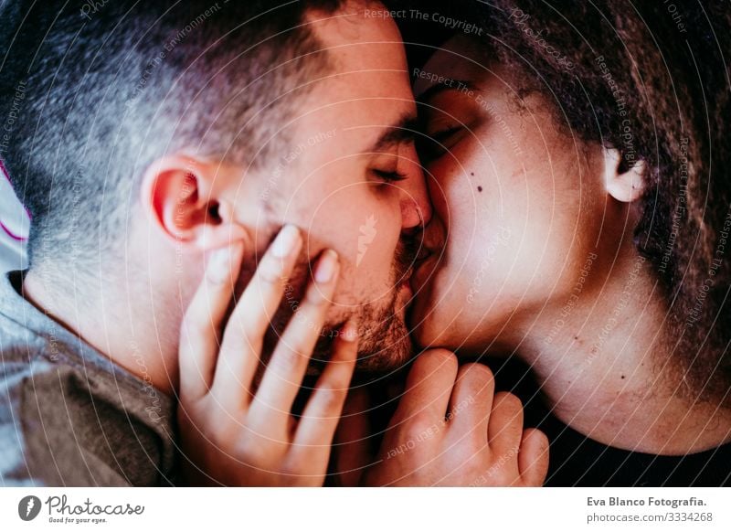 happy couple in love at home. Afro american woman and caucasian man. ethnic love concept Couple Love African-American Ethnic Woman Home Bed Interior shot