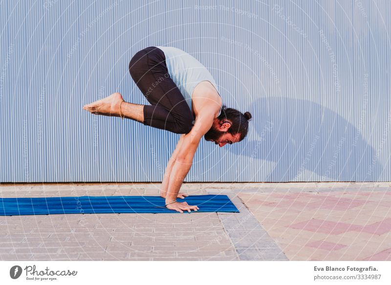 man in the city practicing yoga sport. blue background. healthy lifestyle Yoga Man Sports Healthy Exterior shot City Blue background Muscular