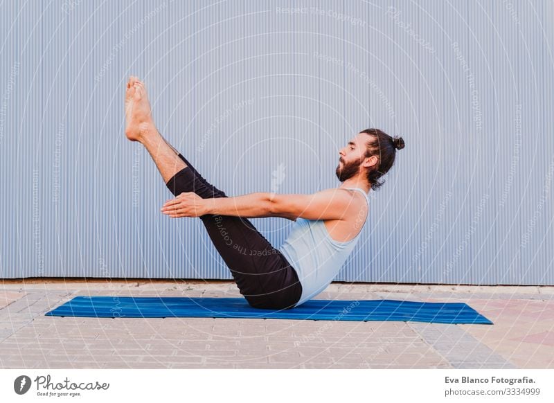 man in the city practicing yoga sport. blue background. healthy lifestyle Yoga Man Sports Healthy Exterior shot City Blue background Muscular