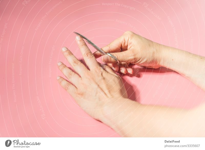 Nail cutter macro detail pink background Beautiful Body Skin Manicure Tool Scissors Human being Woman Adults Hand Fingers Metal Steel Glittering Clean White